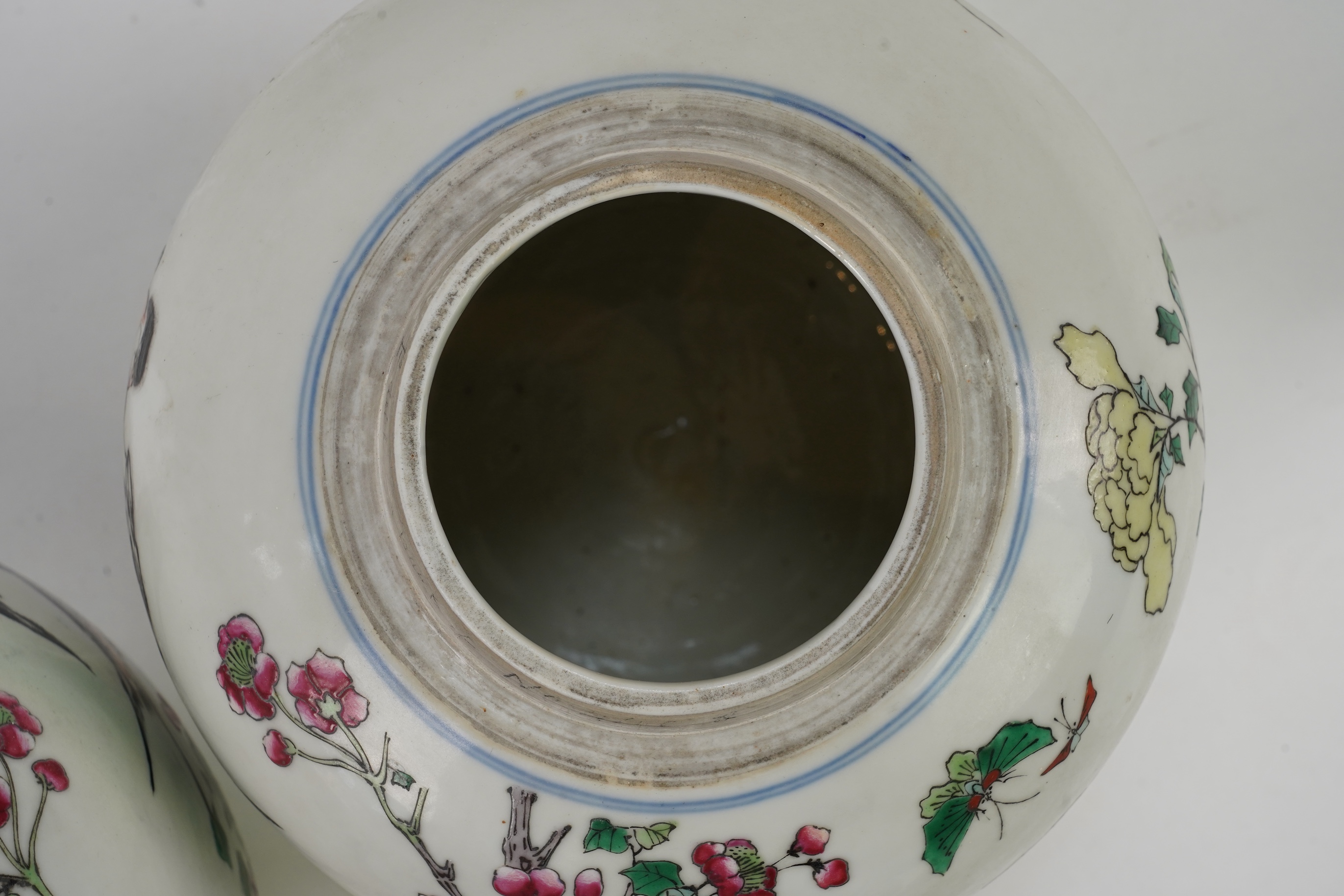 A pair of Chinese famille rose jars and covers, Kangxi mark but late 19th/early 20th century